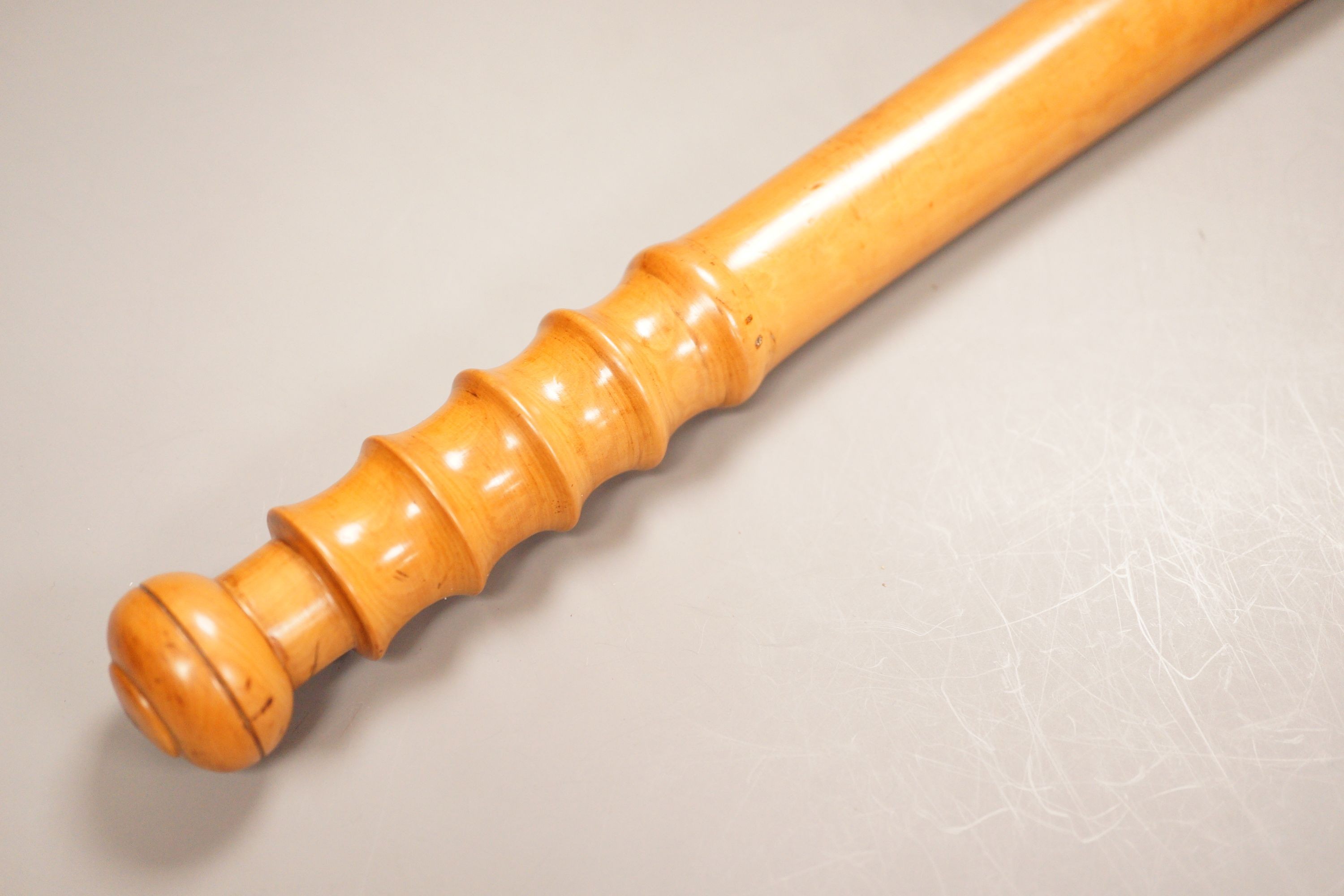 A large 19th century turned boxwood truncheon, stamped ‘Gonin’, 61cm